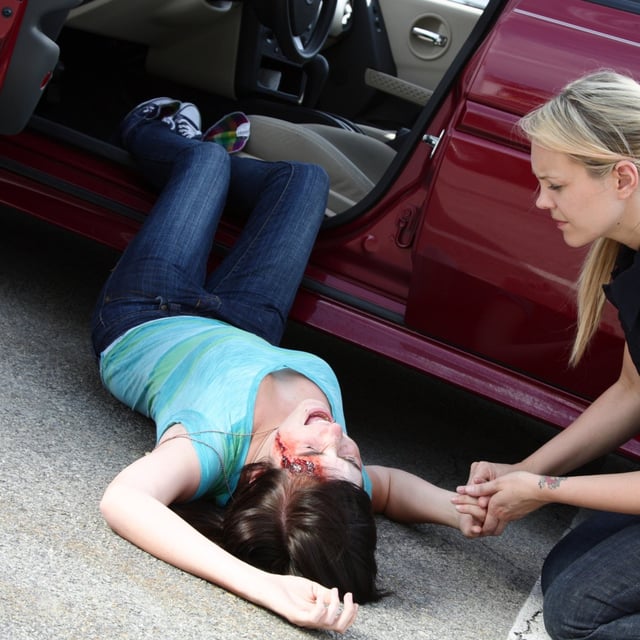 Car Accident Injury Specialist in Englewood, Florida helping a woman after a wreck