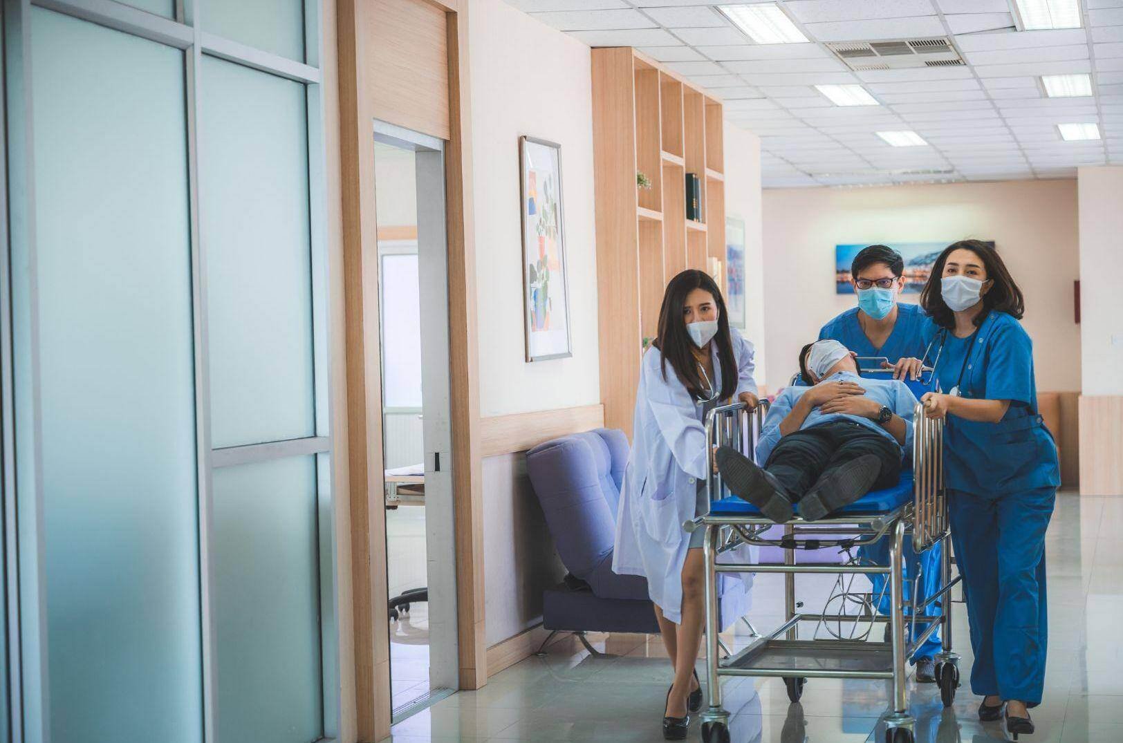 Emergency room doctors transporting a patient on a gurney in Plain, Ohio