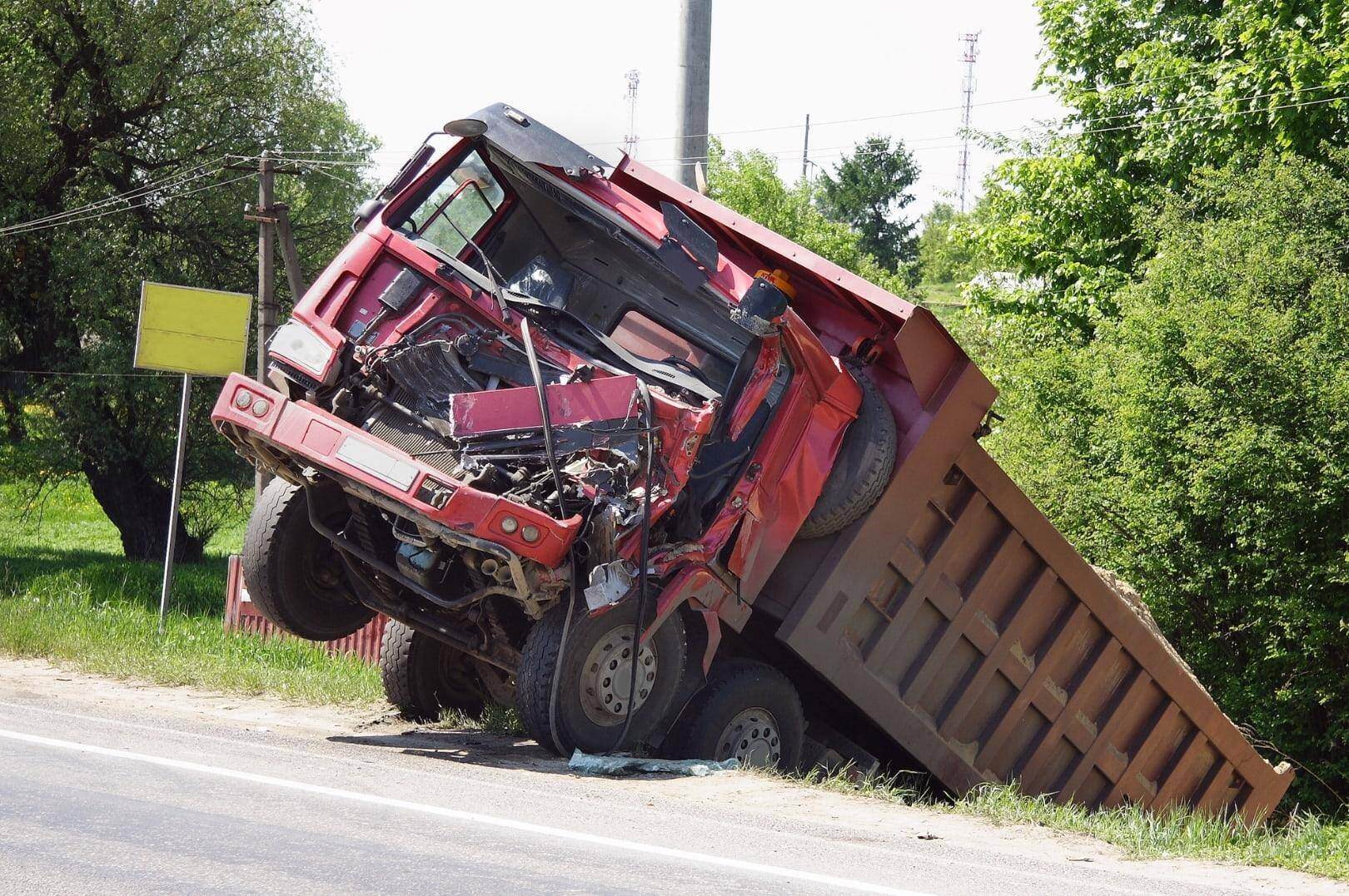 A red truck that has been smashed in a truck accident in Brookhaven, Georgia