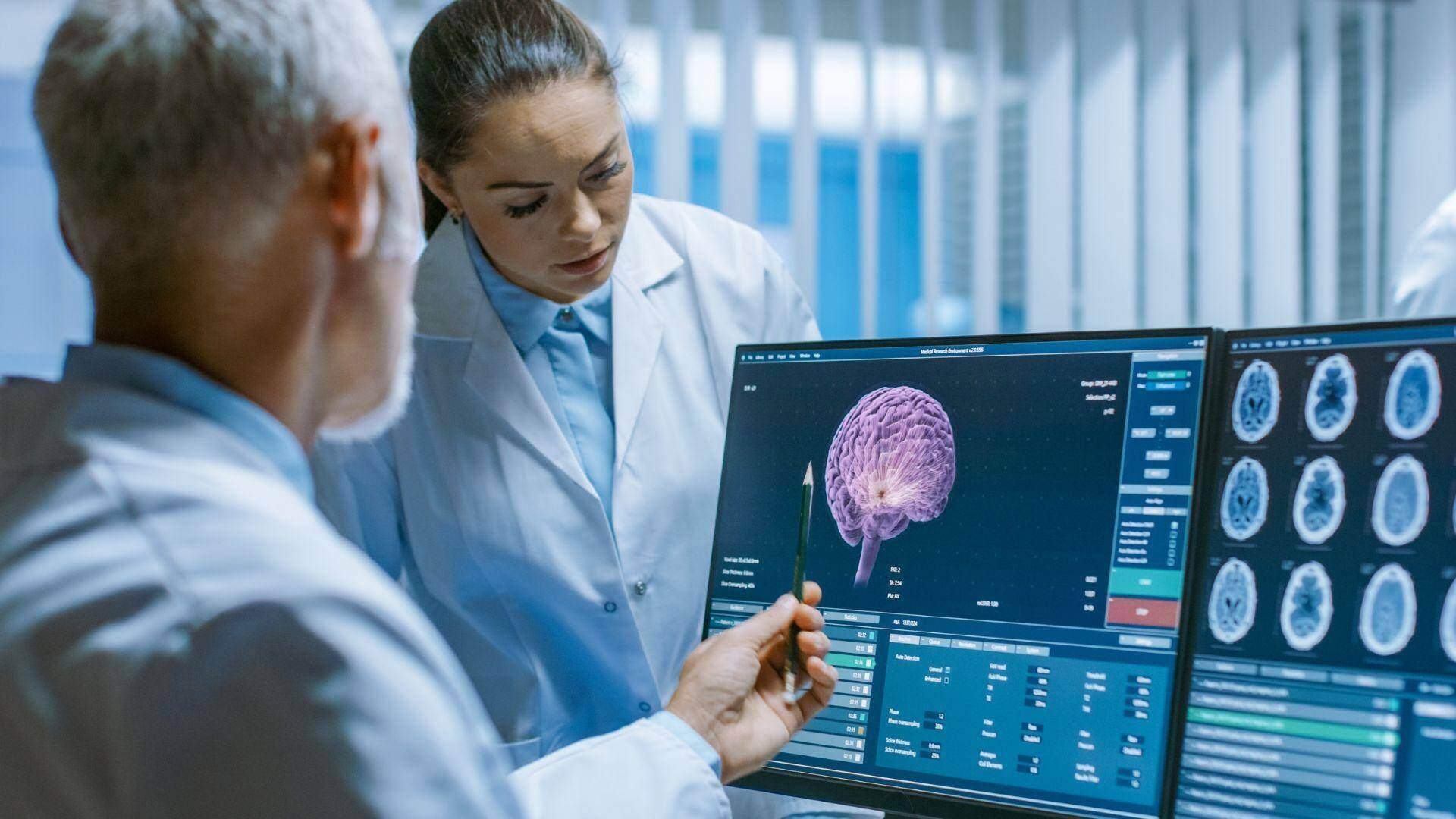 Two neurologists analyzing a brain scan in Oro Valley, Arizona