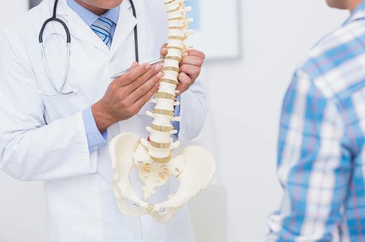 Chiropractor Helping Patient