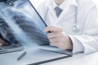 Chiropractor looking over x-rays of a car accident injury in Ocala